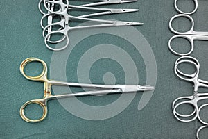 Detail shot of steralized surgery instruments with a hand grabbing a tool