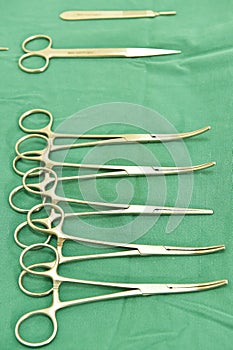 Detail shot of steralized surgery instruments with a hand grabbing a tool