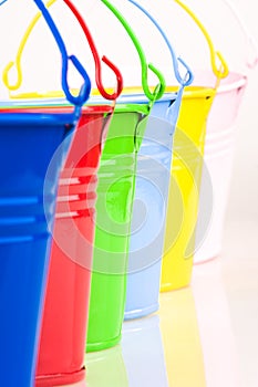 Detail of six coloured buckets