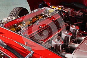 Detail of six cylinder Jaguar XK engine from sixties of 20th century, installed in Jaguar E-Type classic roadster sport car