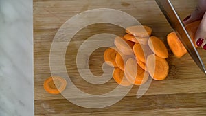 Detail of slicing a carrot