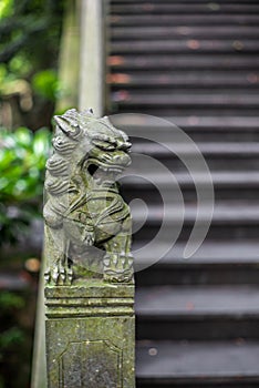 Detail of a small chinese lion sculpture on a stone bridge in a park in Wenzhou in China - 2
