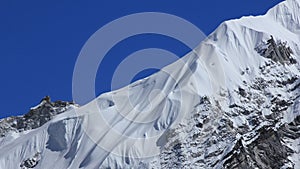 Detail of a snow covered glacier and peak near Gorak Shep