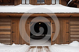 Detail of a snow-covered old wooden gate