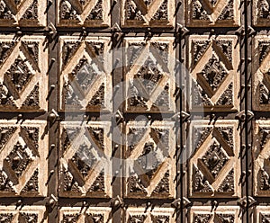 Detail of the solid door of the Convent of San Estaban in the old Salamanca in Spain photo