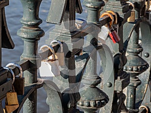 Chained padlocks on the Lover`s Bridge in Prague