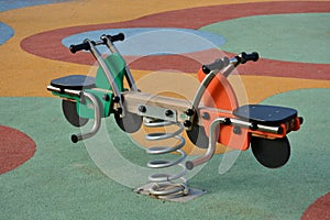 Detail of some of the swings for children in a playground photo