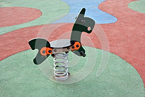 Detail of some of the swings for children in a playground photo