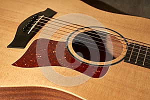 Detail of the sound hole of an acoustic guitar