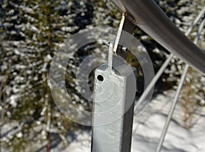 Detail of the stainless steel handrail mounting on the outdoor staircase of the terrace made of bent polished pipe. galvanized pri