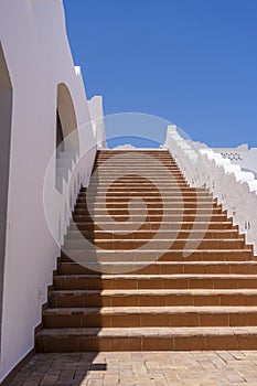 Detail of stairs and white wall of a house on the street of Egypt in Sharm El Sheikh