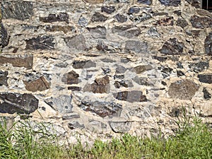 Detail of the stone wall exterior of an abandoned powerhouse at White River Falls State Park, Oregon, USA