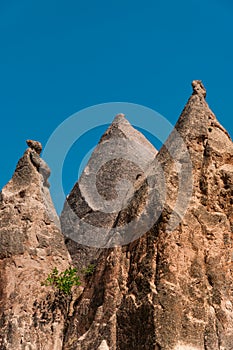 A detail from the structure of Cappadocia. Impressive fairy chimneys of sandstone in the canyon near Cavusin village, Cappadocia.