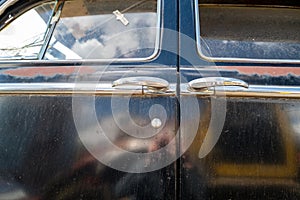 Detail of the suicide doors on a 1948 Dodge Deluxe sedan in Pomeroy, Washington, USA