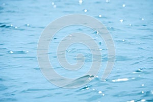 Detail of a sunlight reflecting in glittering sea. sparkler in water - background. sea water with sun glare and ripple. Powerful a