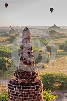 Detail of Ta Wet Hpaya temple in Bagan, Myanmar. Balloons over Bagan visibl