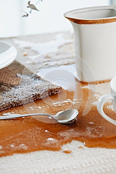table with a puddle of coffee spilled accidentally