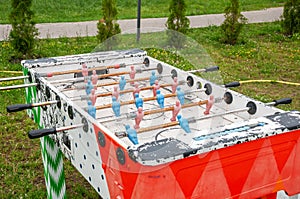 Detail of table football. Old, broken and discarded game