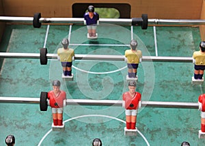 Detail of table football soccer game with red and yellow players