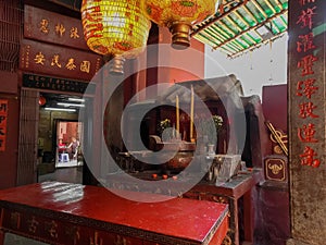 detail of a taoist temple in Macau, with incense offerings