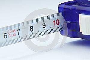 A detail on tape measure in centimetre on white background photo