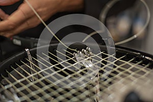 Detail of tennis racket in the stringing machine photo