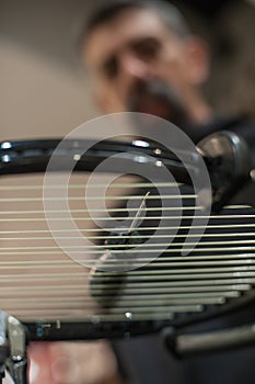 Detail of tennis racket in the stringing machine