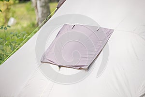 detail of a tent installed in a dense forest in the camp. Weekend activity and hiking or trekking gear and equipment