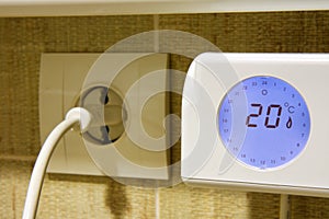 Detail of the thermostat of an electric heater at 20 degrees Celsius