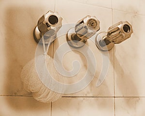 Detail of three faucets in bath