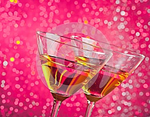 Detail of tilted glasses of cocktail