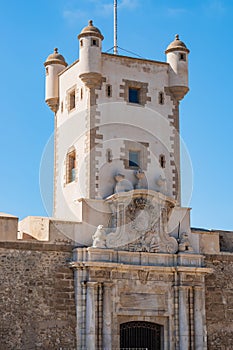 Detail of the tower and portal of the Puerta de Tierra wall that divides the medieval and modern areas of CÃ¡diz, SPAIN photo