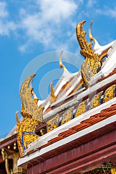 Detail of the traditional ornaments on a roof at the Wat Phra Kaew Palace, also known as the Emerald Buddha Temple. Bangkok, Thail