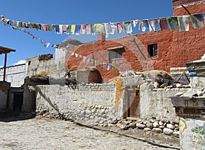 Detail of traditional Tibetan house and prayer flags
