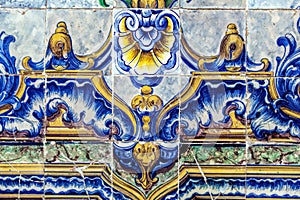 Detail of traditional tiles on facade of old house