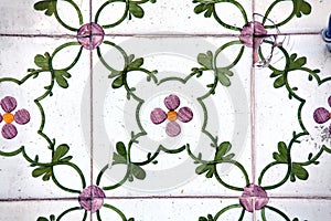 Detail of traditional tiles on facade of old house