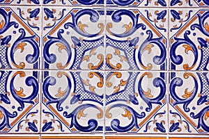 Detail of traditional tiles on facade of old house