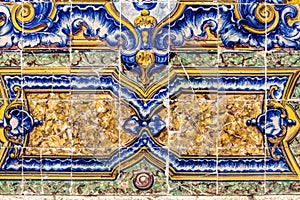 Detail of traditional tiles on facade of old house