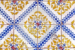 Detail of traditional tiles on facade of old house