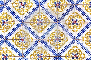 Detail of traditional tiles on facade of old house