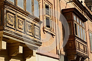 Detail of the traditional wooden balconies. Malta