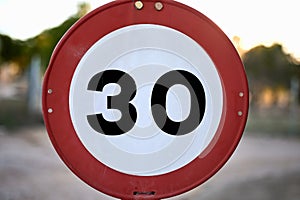 detail of a traffic sign forbidden to drive over 30 mph km h