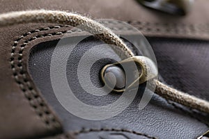 Detail of trekking shoes hook and loop for strap