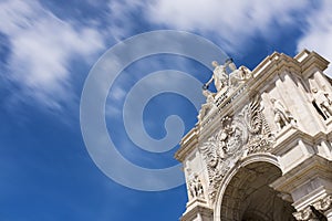 Detail of the Triumphal Arch in the Terreiro do Paco Square against a blue sky in Lisbon