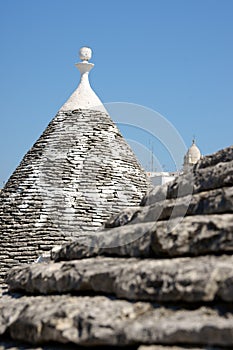 Detail of Trulli house. Focus on background.