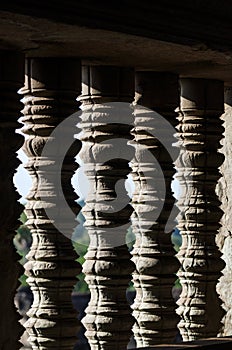 Detail of the turned stone bars of a window at the Angkor Wat in