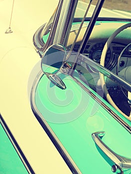 Detail of a turquoise vintage car