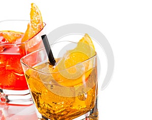 Detail of two cocktail with orange slice on top isolated on white background