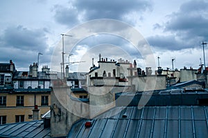Detail of typical Paris rooftops during a cloudy afternoon of autumn, in France