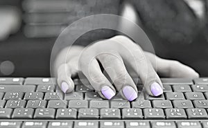 Ultra violet colored nails typewriting photo